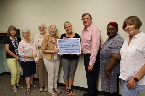 Friends of the Library Posing with Enlarged Check